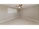 Spacious bedroom with ceiling fan and tile floors at 580 Leach St, Englewood, FL 34223