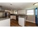 Bright kitchen with white cabinets, granite countertops, and stainless steel appliances at 580 Leach St, Englewood, FL 34223