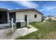 View of the home's backyard, including AC unit at 156 Francis Ne Dr, Port Charlotte, FL 33952