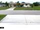 Ranch-style home with attached two-car garage at 156 Francis Ne Dr, Port Charlotte, FL 33952