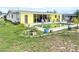 Yellow house with pool and patio at 156 Francis Ne Dr, Port Charlotte, FL 33952