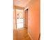 Light-colored hallway with wood laminate flooring at 156 Francis Ne Dr, Port Charlotte, FL 33952
