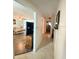 Hallway view with access to living room and bathroom at 156 Francis Ne Dr, Port Charlotte, FL 33952