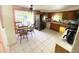 Kitchen with wood cabinets and tiled floor at 156 Francis Ne Dr, Port Charlotte, FL 33952