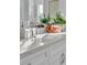 Bright bathroom vanity with white cabinets and quartz countertop at 1529 Rio Vista Ter, Parrish, FL 34219