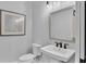 Charming powder room featuring a pedestal sink and tastefully framed artwork, with soft, neutral walls at 1529 Rio Vista Ter, Parrish, FL 34219
