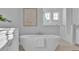 Bright bathroom featuring a soaking tub and walk-in shower at 1529 Rio Vista Ter, Parrish, FL 34219