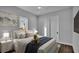 Bright bedroom features a bed with soft pillows, modern decor, and scenic view at 1529 Rio Vista Ter, Parrish, FL 34219