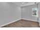 Clean and bright empty bedroom features sleek tile flooring and a window, ready for personalized decor at 1529 Rio Vista Ter, Parrish, FL 34219