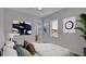 Bedroom featuring modern decor, a window view, and stylish wall art at 1529 Rio Vista Ter, Parrish, FL 34219