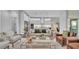 Bright living room with modern decor, comfortable seating, and an open layout to the kitchen, great for entertaining at 1529 Rio Vista Ter, Parrish, FL 34219