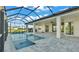 Inviting screened-in pool and patio, perfect for outdoor entertaining with ample seating and picturesque backyard views at 1529 Rio Vista Ter, Parrish, FL 34219