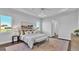 Main bedroom with king-size bed, large windows, and wood floors at 1529 Rio Vista Ter, Parrish, FL 34219