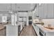 Modern kitchen with island, stainless steel appliances, and white cabinetry at 1529 Rio Vista Ter, Parrish, FL 34219