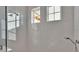 Clean shower with white subway tile and glass enclosure at 1529 Rio Vista Ter, Parrish, FL 34219
