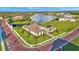 Waterfront property with a brick-paved road and lush landscaping at 1529 Rio Vista Ter, Parrish, FL 34219