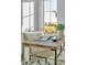 Modern office features a wood desk with metal accents and large window at 1529 Rio Vista Ter, Parrish, FL 34219