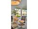 Bright dining room with glass table, elegant vases, and water view at 1529 Rio Vista Ter, Parrish, FL 34219
