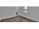 Simple bedroom with hardwood floors and a view at 1529 Rio Vista Ter, Parrish, FL 34219