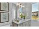 Bright bathroom with vanity, large mirror, and view of backyard at 1529 Rio Vista Ter, Parrish, FL 34219