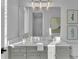 Elegant bathroom with gray vanity, quartz countertop, and framed art at 1529 Rio Vista Ter, Parrish, FL 34219