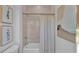 Clean bathroom with a shower/tub combo, updated tile, and stylish wall art at 1529 Rio Vista Ter, Parrish, FL 34219