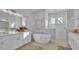Spa-like bathroom with soaking tub, double vanity and shower at 1529 Rio Vista Ter, Parrish, FL 34219