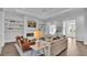 Bright living room with hardwood floors, fireplace, and access to an outdoor patio at 1529 Rio Vista Ter, Parrish, FL 34219