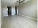 Bright bedroom with wood-look tile flooring and ceiling fan at 1860 Massachusetts Ne Ave # 214, St Petersburg, FL 33703