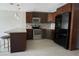 Modern kitchen with stainless steel appliances and granite countertops at 1860 Massachusetts Ne Ave # 214, St Petersburg, FL 33703