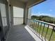 Private balcony overlooking the community pool and lush landscape at 1860 Massachusetts Ne Ave # 214, St Petersburg, FL 33703