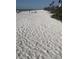 Expansive beach view with people enjoying the sand at 13 Polar Ct, Placida, FL 33946