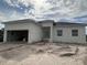 New construction home with attached garage and landscaping at 63 Coxswaine Cir, Placida, FL 33946