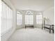 Spacious living room with large windows and carpeted floor at 533 Bent Oak Ct, Spring Hill, FL 34609