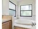 Bathroom with oval tub, double sinks, and shower at 533 Bent Oak Ct, Spring Hill, FL 34609