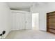 Bright bedroom with double door closet and shelving at 533 Bent Oak Ct, Spring Hill, FL 34609