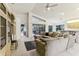 Spacious living room with sectional sofa and access to patio at 533 Bent Oak Ct, Spring Hill, FL 34609