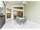 Relaxing screened patio with table and chairs, overlooking the backyard at 533 Bent Oak Ct, Spring Hill, FL 34609