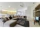 Spacious living room featuring a large sectional sofa and built-in entertainment center at 533 Bent Oak Ct, Spring Hill, FL 34609