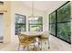 Bright kitchen nook with a round table and chairs, and large windows at 533 Bent Oak Ct, Spring Hill, FL 34609