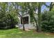 House exterior showcasing a screened porch and lush landscaping at 533 Bent Oak Ct, Spring Hill, FL 34609