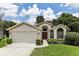 One-story home with attached garage and manicured lawn at 533 Bent Oak Ct, Spring Hill, FL 34609