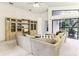 Large living room with sectional sofa and built in shelving at 533 Bent Oak Ct, Spring Hill, FL 34609