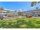 Building exterior showcasing a unique architectural design, landscaping, and ample parking at 2340 Grecian Way # 46, Clearwater, FL 33763