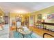 Open concept living and dining area with hardwood floors at 2340 Grecian Way # 46, Clearwater, FL 33763