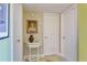 Inviting hallway with decorative table and framed portrait at 2340 Grecian Way # 46, Clearwater, FL 33763