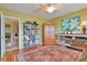 Home office with built-in shelving and hardwood floors at 2340 Grecian Way # 46, Clearwater, FL 33763