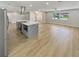 Spacious living room with open concept kitchen and island at 1900 63Rd S Ave, St Petersburg, FL 33712