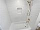 Clean shower with hexagon tile and built-in niche at 1900 63Rd S Ave, St Petersburg, FL 33712