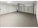 Clean and spacious garage with painted floor and open garage door at 1900 63Rd S Ave, St Petersburg, FL 33712